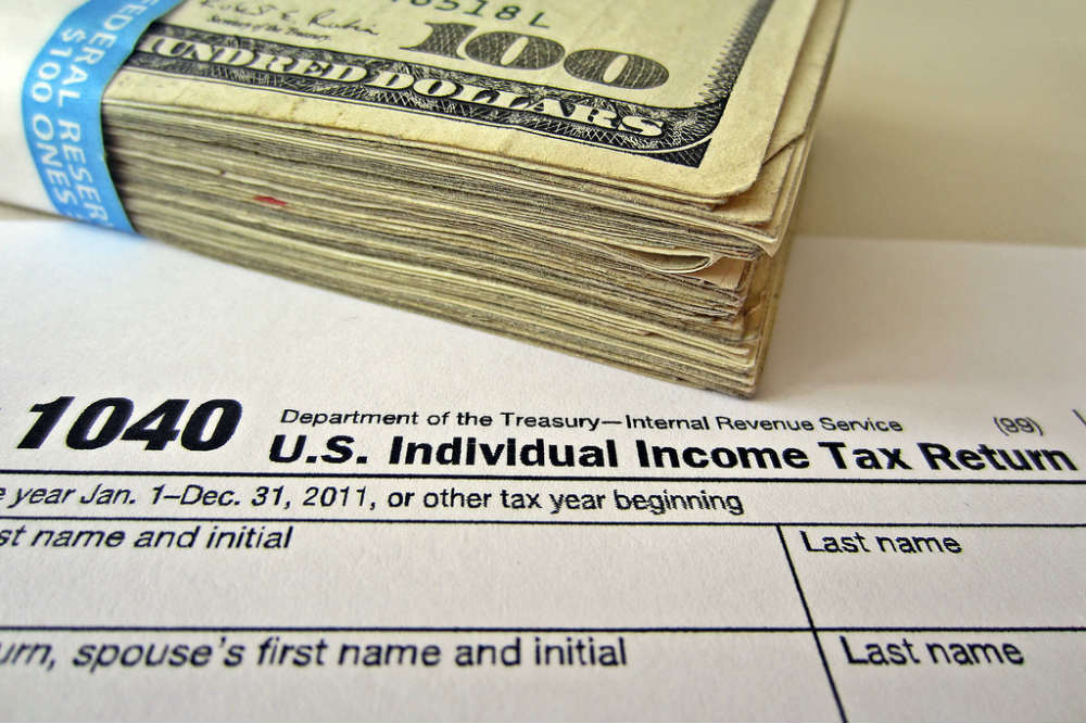 Money and Tax Return - Tax Identity Theft